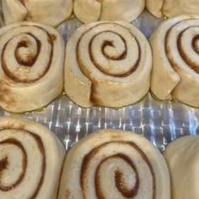 Hand-rolled cinnamon swirls proofing in the pan