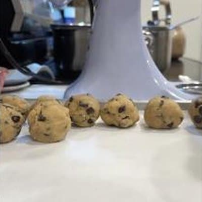 Chocolate chip cookie dough, rolled by hand